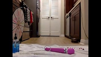 Adorable blonde college girl is fingering her ass from the back in front of her web camera