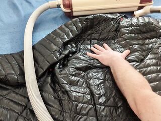 Vacuuming Darksome Shark Ghost Whisperer Down Jacket with Vintage Electrolux Vacuum Cleaner