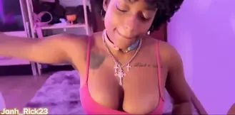 Naughty black cutie with big natural tits gives a nice blowjob