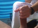 Amateur milf with a wristwatch gives her friend a handjob that has him squirting jizz