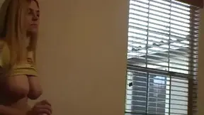 Amateur blonde bombshell Barbi shows off her big tits in a seductive photo shoot