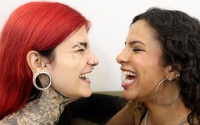 Mibby and Devil Goddess Engage in an Intense Moment of Face-licking