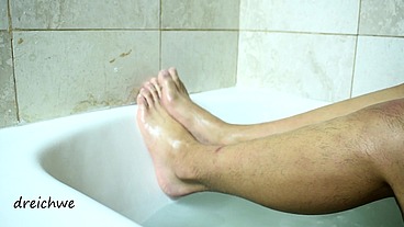 Feet warm in a bathtub with soap