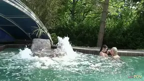 Outdoor lesbians explore passion and warmth by the pool
