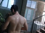 Improvised shower in yard at night