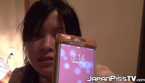Japanese chick wakes up and pees in a jar while on the floor