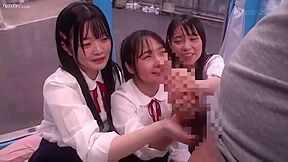 Three beautiful girls in uniform get excited when they see a man's penis and cum all over his hands.