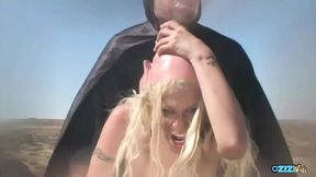 The blonde babe's backpack was ripped off, leading to a chaotic sandstorm gangbang.