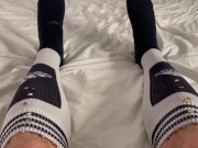 Macrophilia - tiny people hide in giants football socks