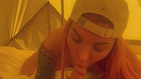 Trans girl blowing massive cock in a tent
