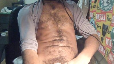 ROCK MERCURY JERKS HIS HUGE HAIRY DICK LATE NIGHT IN HOME OFFICE BALLS BOUNCE CUMS ON SEXY PUBES