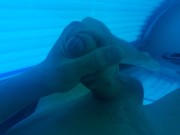 Boy masturbating in solarium