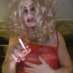 Crossdresser, smokes, fucks  herself with fake black cock, wanks