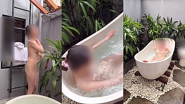 Bathing in an outdoor bath in a foreign country with old men and chickens nearby