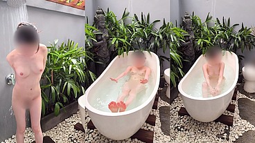 Bathing in an outdoor bath in a foreign country with old men and chickens nearby