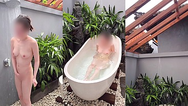 Bathing in an outdoor bath in a foreign country with old men and chickens nearby