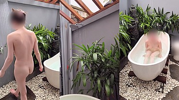 Bathing in an outdoor bath in a foreign country with old men and chickens nearby
