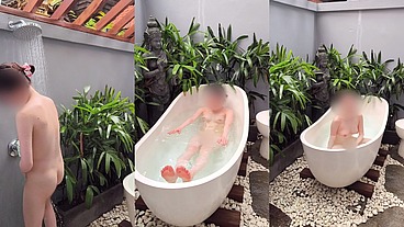 Bathing in an outdoor bath in a foreign country with old men and chickens nearby