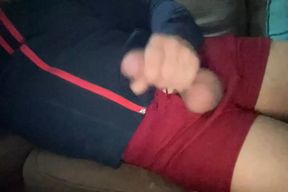 Stroking wearing gym teacher shorts, online video chatting with another coach.