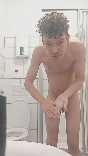 Young man showering