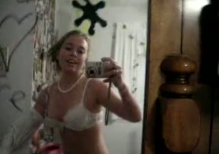 Solo scene with a nasty teen stripping in front of a mirror