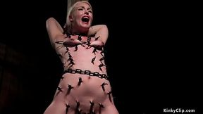 Shackled blonde gets pussy vibrated