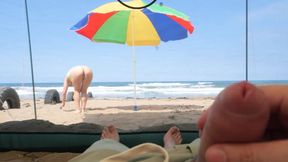 matured tourists have extreme outdoor handsjob on the beach.