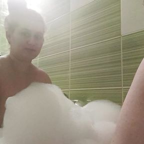 Couple take a bath and he touch her busty body