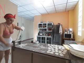 A bare housewife is preparing dinner in the kitchen. The dissolute whimsical housekeeper Brassiere 1