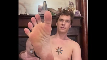 Daniel sticks his foot at the camera and shakes his bells