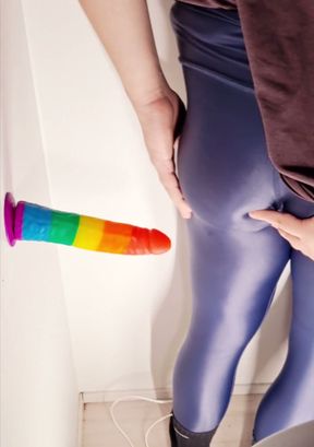 Crossdresser enjoying big toy in shiny leggings