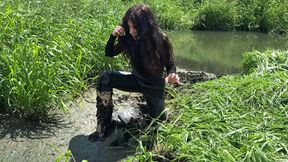 Girl is sinking in deep mud, exploring a swamp, a girl in a swamp, a girl chest deep in a swamp, sinking in deep mud, girl got stuck in swamp