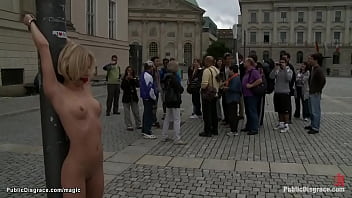Blonde European hottie Paris Pink is gagged and bound to metal pole in public for onlookers then in stairs fucked by big cock master Tommy