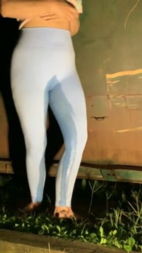 Slut drenches her yoga pants in piss outdoors