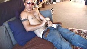 John is back and this time wearing a polo shirt and shades. He settles down and gets into his alone time. After oiling up his dick, John strokes it while watching porn and occasionally narrating.