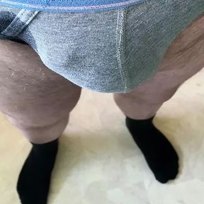 Grey underwear and black socks pissing