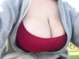 Large titted hottie loves to display her cleavage during the time that in a public place, during the day