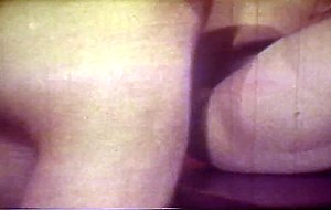 Horny doctor banging his nurse in vintage porno scene