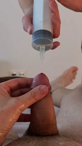 Piss injection. She injects her piss into his urethra.