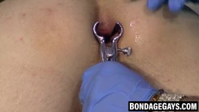 Bent over twink screams through kinky toy torture