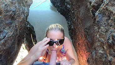 Blonde tour guide blows tourist on the beach