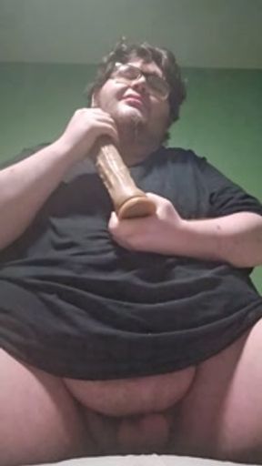 Fat male in chastity sucking a dildo and drooling like a waterfall