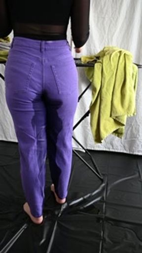 Wetting Purple Jeans While Doing Laundry