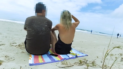 Filming an anal scene on the beach in front of passersby