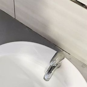 Risky pee in sink at public toilet