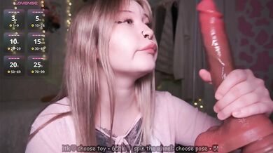 Cute Asian girl sucks a thick dildo and enjoys it - NesThiccDuo