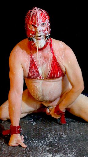 Submissive Slave sucks large ejaculating dildo and is covered in cum, which he eats and swallows!