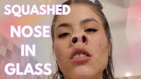 SQUASHED NOSE IN GLASS
