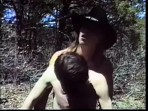 Hot dude in a cowboy hat drills his friend's asshole outside in the woods