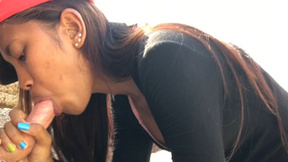 Petite amateur Thai teen nympho Cherry sucking a big dick at the beach